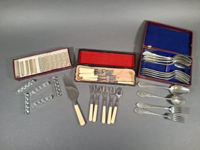 a lot of silverware in a box on a table