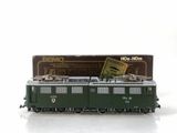 a toy train on a white surface with a box