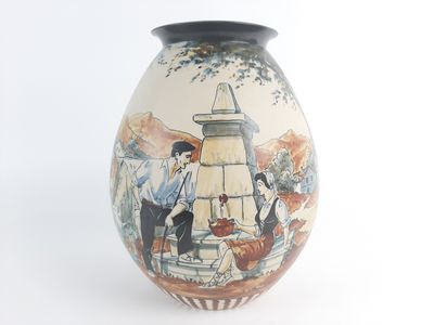 a vase with a picture of a man and a woman on it