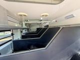 an image of a horse trailer that is parked in a lot