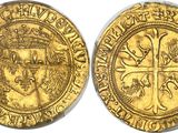 a gold coin with a crown on the front and a crown on the back