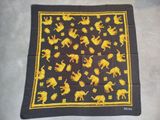 a black and yellow scarf with yellow horses on it