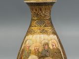 a vase with a lot of pictures on it