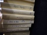 books stacked on top of each other with writing on them