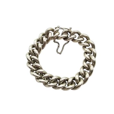 a close up of a silver chain bracelet on a white background