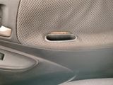 a close up of a car ' s door handle with the door handle open
