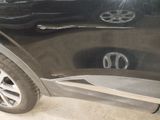 a close up of a car door with a sticker on it