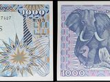 trois billets de banque différents, dont l'un comporte l'image d'un éléphant
