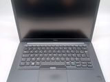 an open laptop computer sitting on top of a white table