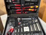 a tool case with tools in it sitting on top of a table