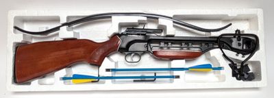 a toy gun in a plastic box with a cord