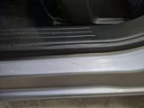 a close up of a car door handle with the door handle open