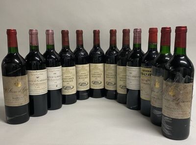 several bottles of wine are lined up in a row on a table