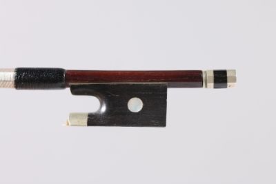 violin bow made of wood and metal on a white background