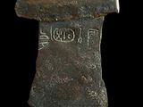 a close up of a metal object with writing on it