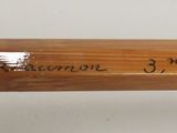 a baseball bat that has writing on it