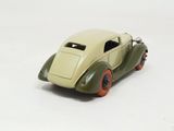 a toy car that is sitting on a white surface