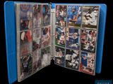 a picture of a blue folder with baseball cards inside of it