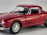 an image of a red model car on a white background