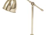 une image représentant une lampe de bureau en laiton sur fond blanc