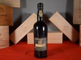 a bottle of wine that is sitting on a table