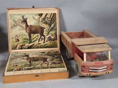 two boxes with pictures of animals on them and a box with a lid