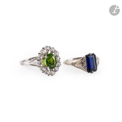 two rings with different colored stones and diamonds on a white background