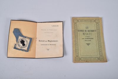 an open book with a blue cover sitting next to a book with a picture of a bird on it