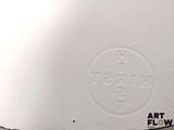 a close up of a piece of paper with a picture of a clock on it