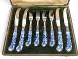 six forks and six knives in a case