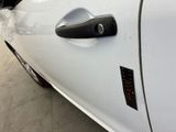 a close up of a car door handle with a sticker on it