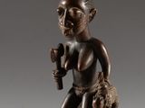 an image of a statue of a man with a hammer on top of his head
