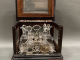 a glass display case with a lot of glass items in it