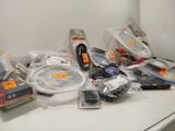 a lot of electronics on the counter in the room