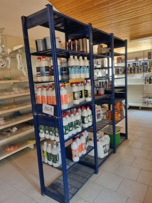 a store with shelves full of different types of cleaning products