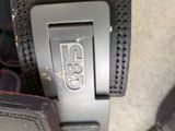 a close up of a seat belt with a logo on it