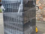 a stack of boxes wrapped in plastic sitting on a pallet