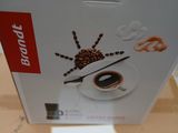 emballage d'une boîte de café sur laquelle figure l'image d'une araignée