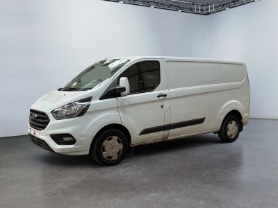 the white van is parked in a large white room