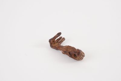 a close up of a piece of wood on a white surface