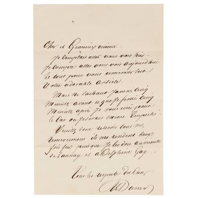 une lettre écrite en cursive sur un bout de papier