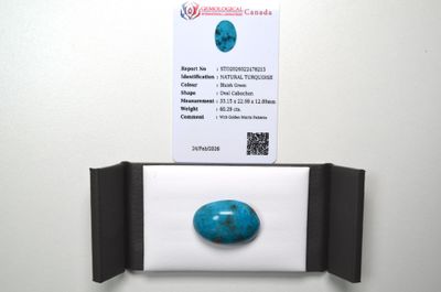 a picture of a business card and a stone on a wall