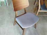 a chair that is next to a table in a room