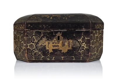 a black and gold box sitting on a white surface
