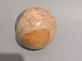 a ball with a design on it sitting on a table