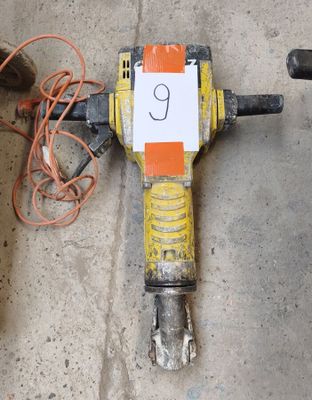 a drill that is laying on the ground with a number 9 on it