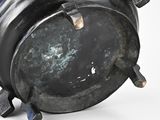 a large metal pot sitting on top of a white surface
