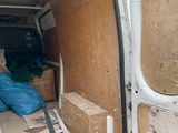 a white van with a bunch of boxes in the back