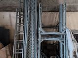 a pile of boxes and a ladder in a room