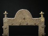 an image of a gold sculpture on a black background